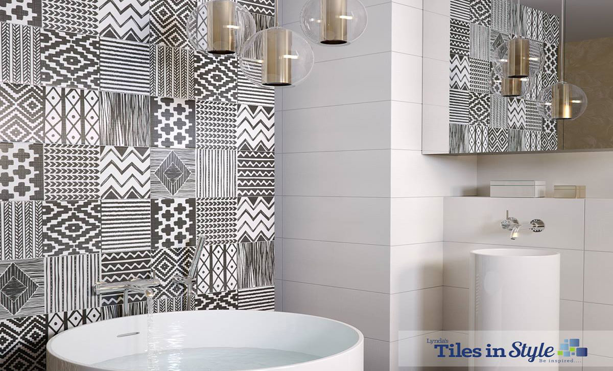 Feature wall tiles behind a sink in a modern bathroom