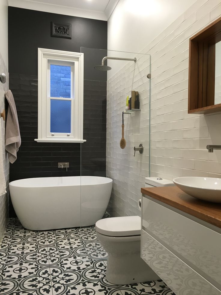 A small bathroom with feature pattern floor tiles - Tiles Bundaberg, QLD
