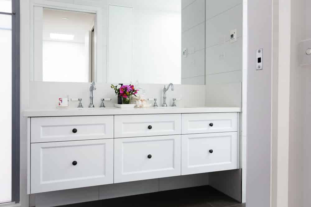 Bathroom With White Cabinets